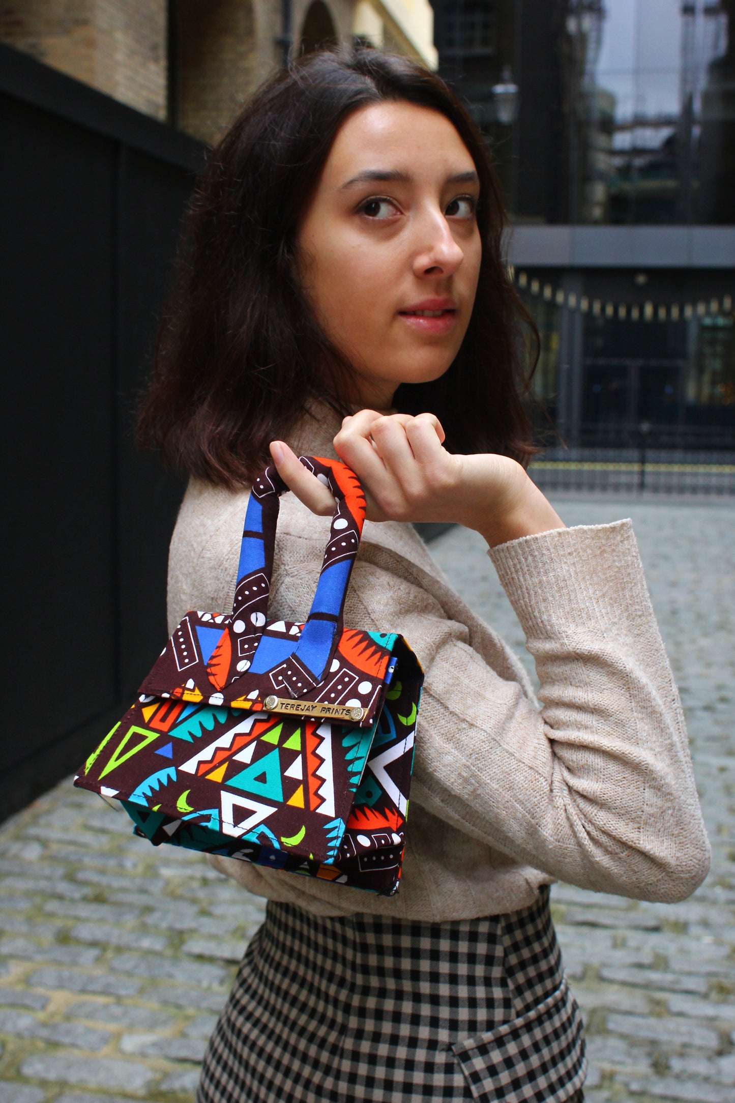 Girl holding African Print Mini Bag