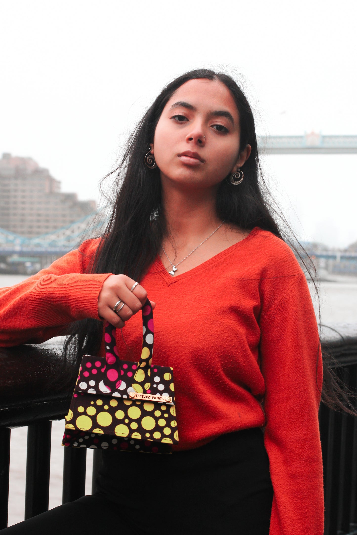 Girl holding African Print Mini Bag