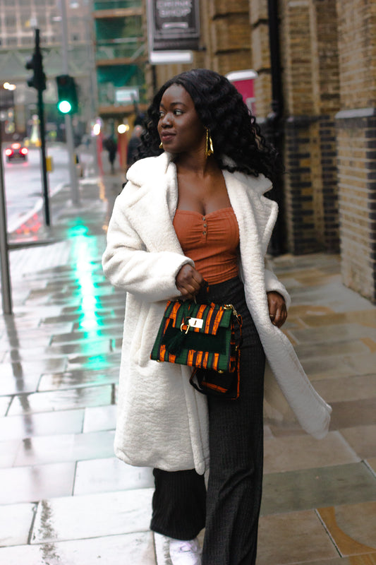 Girl holding green African Print Mini Bag